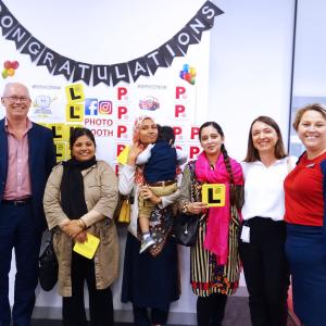 Group of women showing their Ls proudly
