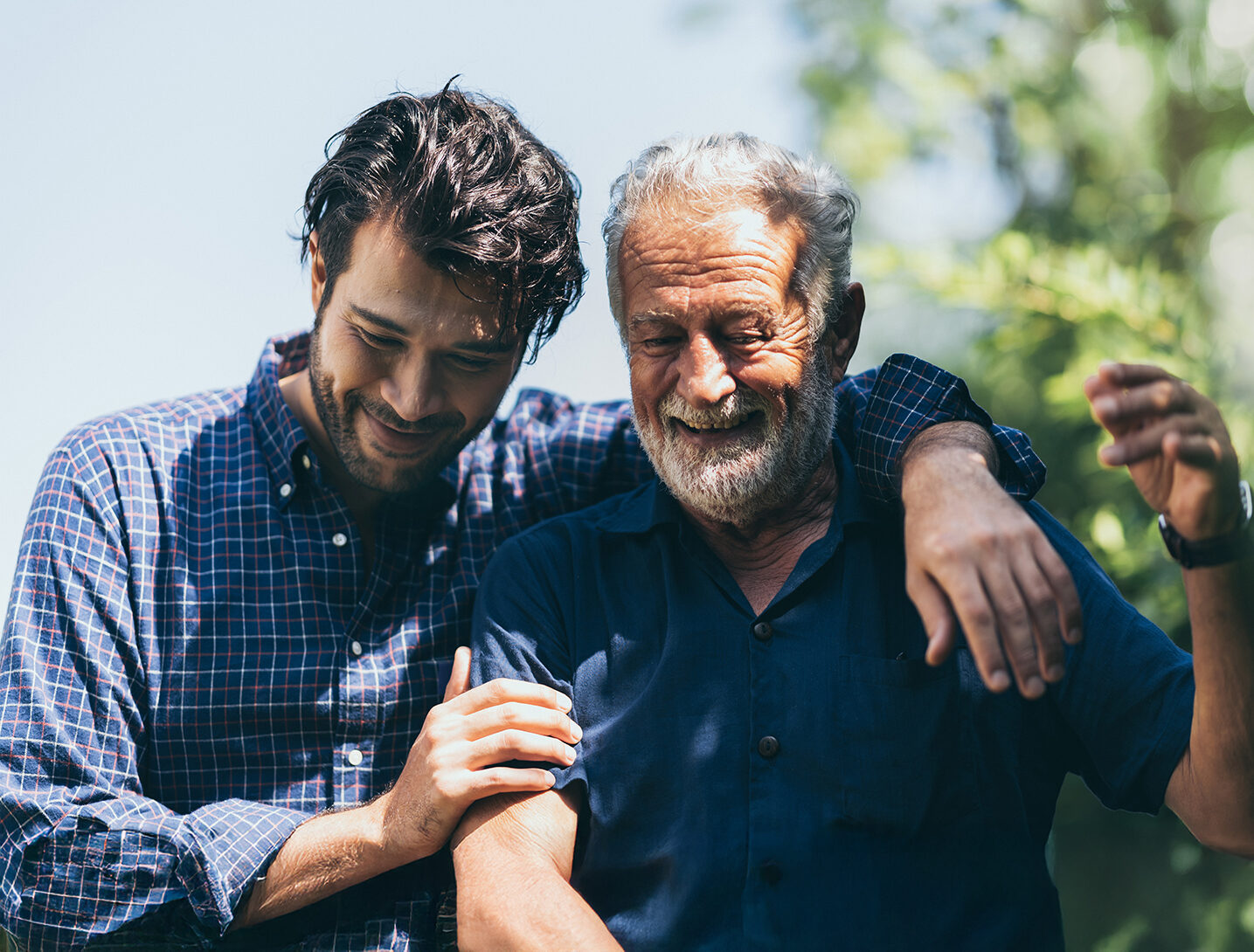 senior father with adult son in family concept banner background with copy space, elderly old man person are happy and enjoy with hipster son together by walking outdoor in nature